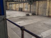 a view of the inside of a train station from the back of a bus driving by