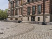 Berlin, Germany: Urban Building on Cobblestone Street