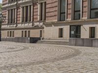 Berlin, Germany: Urban Building on Cobblestone Street