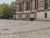 Berlin, Germany: Urban Building on Cobblestone Street