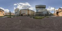 the building has a lot of windows in it as seen in this circular view lens