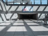 this is an entrance to the station with stairs and balconies on either side