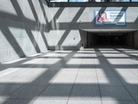 this is an entrance to the station with stairs and balconies on either side