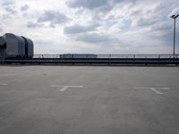a boat is parked in an empty parking lot near an air port on the water
