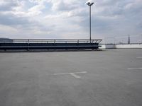 a boat is parked in an empty parking lot near an air port on the water