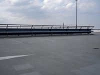a boat is parked in an empty parking lot near an air port on the water