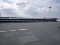 a boat is parked in an empty parking lot near an air port on the water