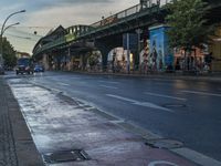 the view under the highway, on a rainy day of the city street and on the streets with buildings and bicycles