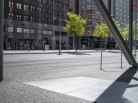 view of an empty city street and the reflection of a building across it in a mirror