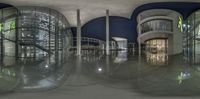 a 3d image shows an empty lobby in an office building at night time with reflective flooring