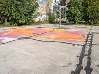 a painted street with a butterfly in the middle of it with graffiti on the pavement