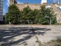 there is an empty lot in the middle of the city with many other old buildings in it