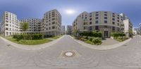 360 - time view of a street from outside a building with a circular brick patio