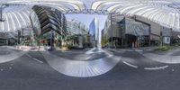 a panorama is showing the city's streets and buildings in it's reflection