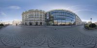 this is a 360 - view of a city street with a traffic light and large buildings