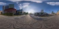 fish - eye view of some buildings and some roads from the side of the street