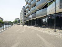 there is an empty street between two large buildings in the city where the building sits