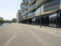 there is an empty street between two large buildings in the city where the building sits