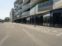 there is an empty street between two large buildings in the city where the building sits