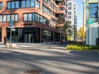 a picture of an empty street in front of a tall building with windows and a sign above it that says u s bank