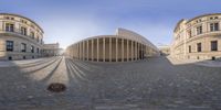 a fish eye view is of the circular structure that the building sits on, it is built of bricks and stones