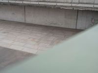 an overhead view of some cement bricks in a room on the ground on a cloudy day