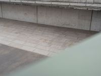 an overhead view of some cement bricks in a room on the ground on a cloudy day