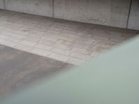 an overhead view of some cement bricks in a room on the ground on a cloudy day