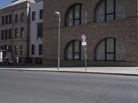 the street sign is indicating that no parking at this corner is empty and empty on all sides