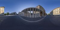 360 - view image of street intersection with tall pillars with round shaped columns around it