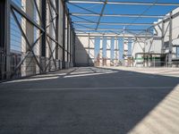 the inside of an industrial building with steel mesh around the outside and metal framed windows