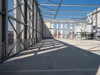 the inside of an industrial building with steel mesh around the outside and metal framed windows