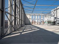 the inside of an industrial building with steel mesh around the outside and metal framed windows