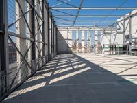 the inside of an industrial building with steel mesh around the outside and metal framed windows
