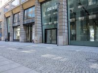 a car drives past a drive it building on the road from london to dublin, on