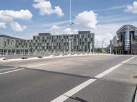 a big building that is next to a large road on a clear day in the city