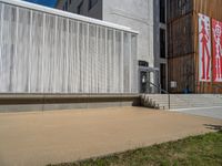 a group of people riding skateboards near wooden panels and stairss with artwork on them