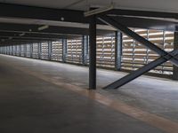 a parking garage with a large amount of shelves and racks of equipment inside of it