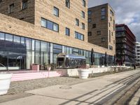 there is a picture of a restaurant outside the building that is surrounded by grass and trees