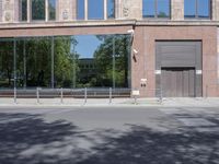 an empty empty parking space outside a building with an iron gate that is next to it