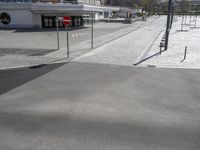 the street is empty in the middle of the city with no cars to travel across