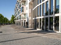 a large building has many windows and doors on both sides of the walkways, which also look very nice