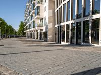 a large building has many windows and doors on both sides of the walkways, which also look very nice