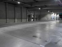 a photo of a building and lights and floor and walls with metal grate flooring