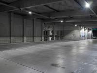 a photo of a building and lights and floor and walls with metal grate flooring