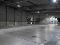 a photo of a building and lights and floor and walls with metal grate flooring