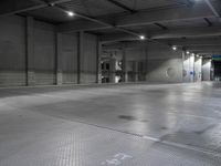 a photo of a building and lights and floor and walls with metal grate flooring