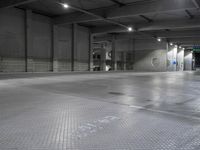 a photo of a building and lights and floor and walls with metal grate flooring