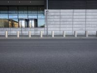 a picture of a concrete building that looks like an industrial structure with no cars in front