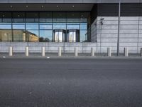 a picture of a concrete building that looks like an industrial structure with no cars in front